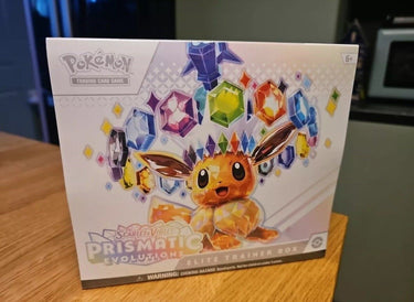 Pokemon TCG SV8.5 Prismatic Evolutions Elite Trainer Box on table